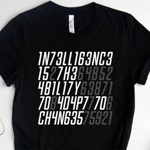 May include: Black t-shirt with the word "INTELLIGENCE" spelled out in a series of numbers and letters in white and gray. The shirt is made of a soft material.