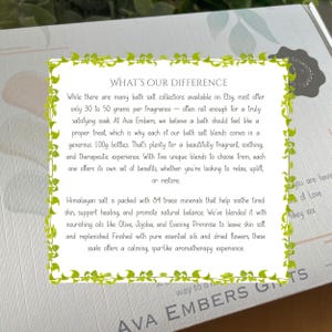 May include: A gift box with text that reads "WHAT'S OUR DIFFERENCE" and "AVA EMBERS GIFTS". The text describes bath salt blends with Himalayan salt, essential oils, and dried flowers. The box has a decorative green border.