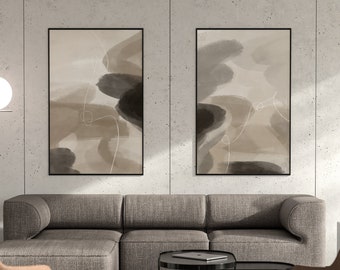 May include: Two abstract art prints with a beige and brown color scheme. The prints feature a series of overlapping shapes and lines in a minimalist style. The prints are framed in black and hung on a concrete wall.
