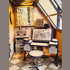 May include: A miniature wooden model of a room with a desk, chair, and a small radio. There are two cats cut out of wood sitting in a window. The room has a checkered floor and a skylight.