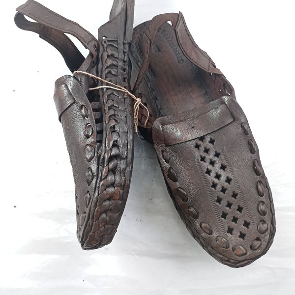 Stride in Style Handmade Brown Leather Slipper, Genuine Kolhapuri Chappal with Criss-Cross Design. Explore Unique Leather Slippers and Mules