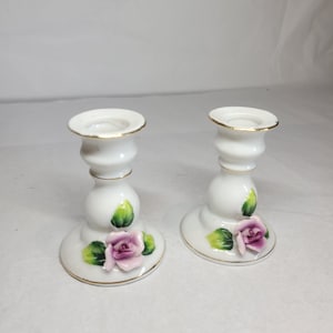 2 x Small china candlesticks decorated with flowers