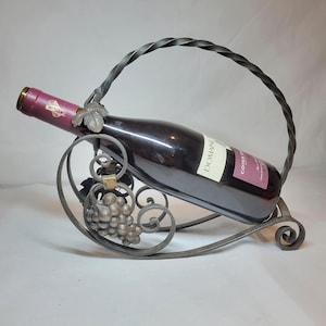 Vintage grapes and vine leaves metal wine bottle holder.