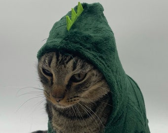 Suéter de gato dinosaurio