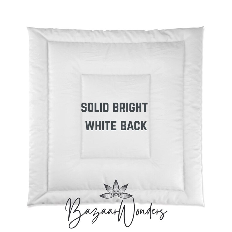 May include: A white comforter with a quilted design. The text "SOLID BRIGHT WHITE BACK" is printed in the center. The Bazaar Wonders logo is at the bottom.