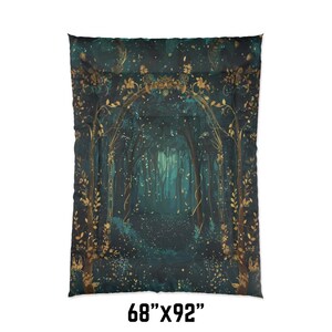 May include: A dark teal comforter with a forest scene. The design features a pathway through a forest with gold accents. The comforter measures 68" x 92".
