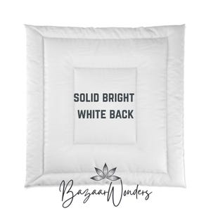 May include: A white, square-shaped comforter with a quilted pattern. The text "SOLID BRIGHT WHITE BACK" is centered on the comforter. The Bazaar Wonders logo is at the bottom.