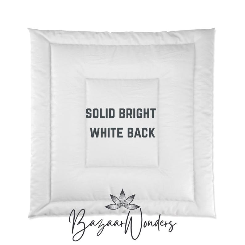 May include: A white, square-shaped comforter with a quilted pattern. The text "SOLID BRIGHT WHITE BACK" is centered on the comforter. The Bazaar Wonders logo is at the bottom.