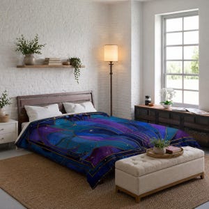 May include: A blue and purple comforter with a celestial design featuring gold accents. The comforter is on a wooden bed frame in a bedroom setting. The room has a neutral color palette.