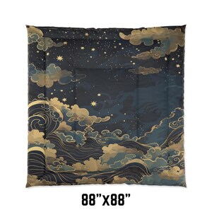 May include: A dark blue comforter with a celestial design. The comforter features a night sky with stars, clouds, and waves in gold and blue. The comforter measures 88" x 88".