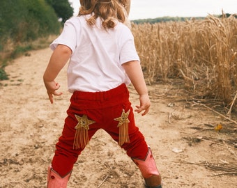Pantaloni rossi con stelle di strass per neonati e bambini