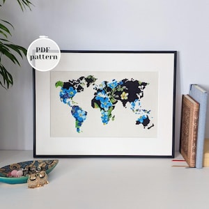 Weltkarte mit Blumen Design Kreuzstichmuster. Moderne Anfänger-freundliche Nadelspitzen-Anleitung. Haussegen Stickerei Geschenkidee