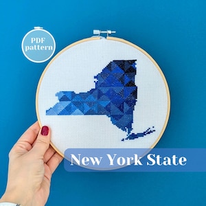 New York state map cross stitch pattern. Modern needlepoint ornament design in dark blue. United States (USA) themed housewarming gift