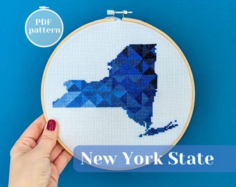 New York state map cross stitch pattern. Modern needlepoint ornament design in dark blue. United States (USA) themed housewarming gift