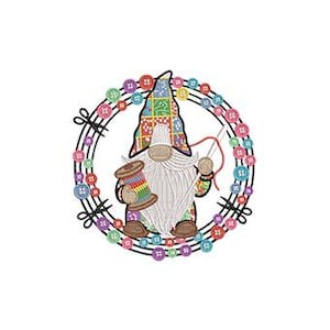 May include: A whimsical gnome illustration holding a spool of thread and a needle, surrounded by a wreath of colorful buttons. The gnome wears a patterned hat and has a long white beard. The design is set against a white background.