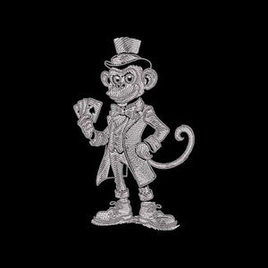 May include: A detailed silver-colored illustration of a monkey dressed in a suit, top hat, and bow tie, holding playing cards. The monkey has a detailed textured design and is set against a black background. The monkey is wearing shoes.
