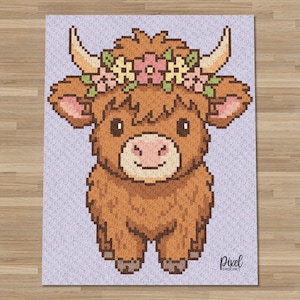 May include: A pixelated illustration of a Highland cow with brown fur, large horns, and a floral crown. The cow has a light pink nose and is set against a light purple background. The words "Pixel Crochet" are in the bottom right corner.
