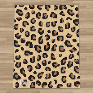 May include: A pixel art rug featuring a leopard print design in shades of brown, black, and beige.