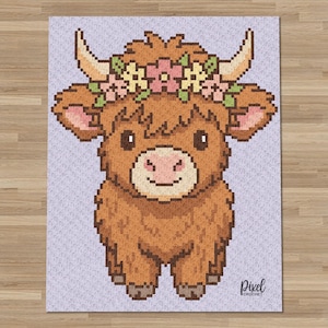 May include: A pixel art pattern of a brown Highland cow with a flower crown featuring pink and yellow blossoms. The cow has curved horns, a light muzzle, and dark eyes. The background is a light purple color with the text Pixel Crochet in the corner.
