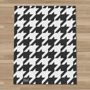 May include: Black and white houndstooth pattern. The pattern is repeated throughout the image. The image has a pixelated look.