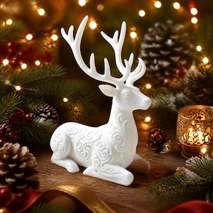 May include: A white, matte-finish deer figurine in a resting position, featuring intricate, embossed swirl patterns across its body and tall, branching antlers. The deer is sculpted with a smooth surface and detailed facial features.