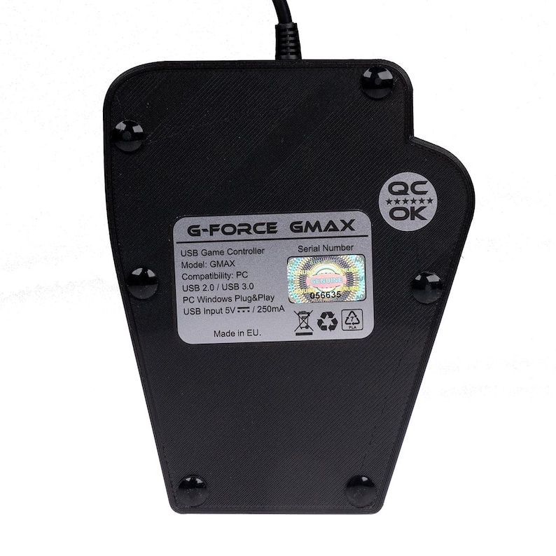 May include: Black USB game controller with the text "G-FORCE GMAX" and "USB Game Controller" printed on the back. The serial number is 056635. The controller has a quality control sticker that says "QC******OK".