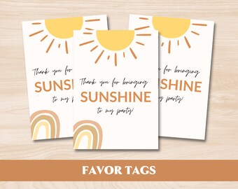 May include: Three favor tags with a sun and rainbow design. The text on the tags reads "Thank you for bringing sunshine to my party!"