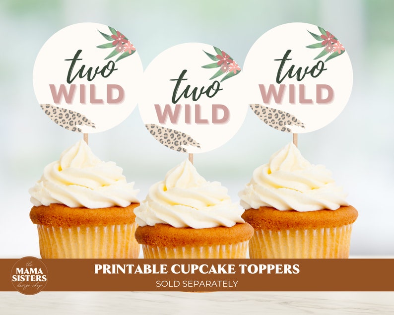 May include: Three cupcake toppers with a white background and pink and green floral accents. The toppers feature the text "two wild" in black and pink lettering. The toppers are designed for a two-year-old birthday party.