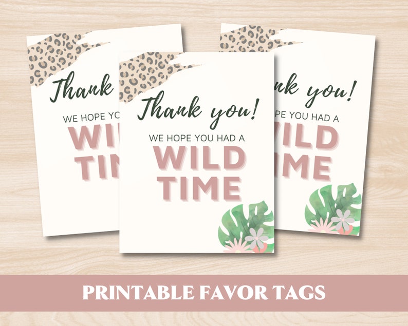 May include: Three printable favor tags with a jungle theme. The tags are white with pink text that says "Thank you! We hope you had a wild time."  The tags are decorated with a leopard print, green leaves, and pink flowers.