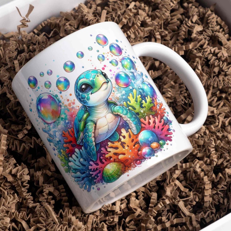 May include: White ceramic mug with a colorful illustration of a sea turtle swimming in a coral reef with iridescent bubbles. The turtle has a green shell and a light blue body.
