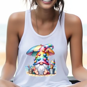 May include: A white tank top featuring a colourful gnome wearing a rainbow hat adorned with seashells and holding an ice cream cone. The gnome is seated on a beach beneath a beach umbrella.