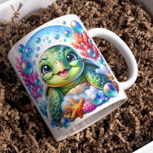 May include: White ceramic mug with a colorful illustration of a cartoon sea turtle with big eyes and a happy expression. The turtle is surrounded by bubbles and coral.