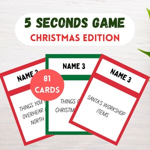 May include: A set of 81 Christmas-themed game cards with red and green borders. The cards are divided into three categories: Things You Overhear at the North Pole, Things You See at Christmas, and Santa's Workshop Items.