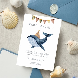 May include: A blue whale with a party hat and a string of colourful flags above it. The text on the invitation reads "Whale, Oh Whale... Henry is turning Two! Join us for a birthday celebration December 28 @ 1PM"