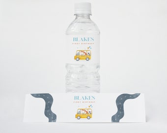 May include: Water bottle labels with a yellow school bus design. The labels say "Blake's First Birthday".