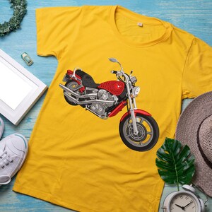 May include: Yellow t-shirt with a red and black motorcycle graphic.