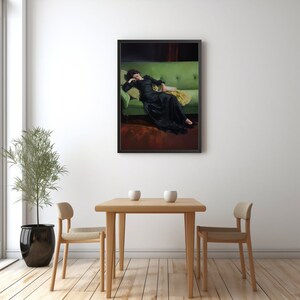 May include: A framed painting of a woman in a black dress lying on a green sofa. The woman is asleep with her head resting on a pillow. The sofa is in a room with a red rug and a dark brown wall.