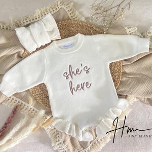She’s here embroidered Romper, knit ribbed ruffle romper custom, gender reveal announcement, it’s a girl