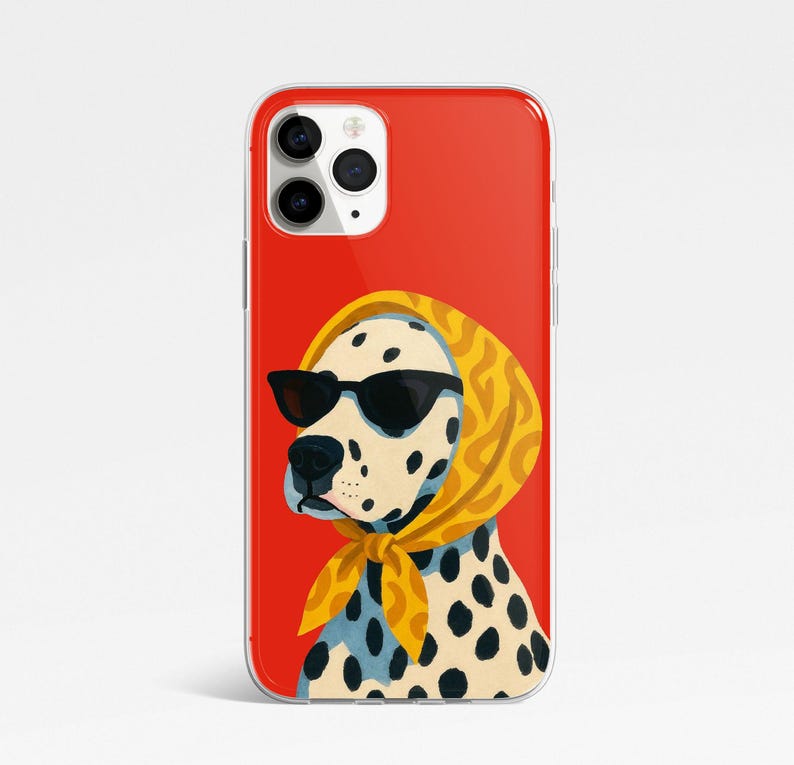 May include: A red iPhone case featuring a Dalmatian dog wearing black sunglasses and a yellow headscarf. The dog has black spots and is set against a solid red background.