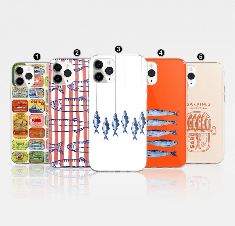 May include: Five different phone cases with a seafood theme. The cases are all white with different designs. One case has a red and white striped background with blue fish. Another case has a white background with blue fish hanging from strings. Another case has a red background with blue fish. Another case has a white background with a can of sardines. The last case has a white background with a can of sardines and a blue fish.