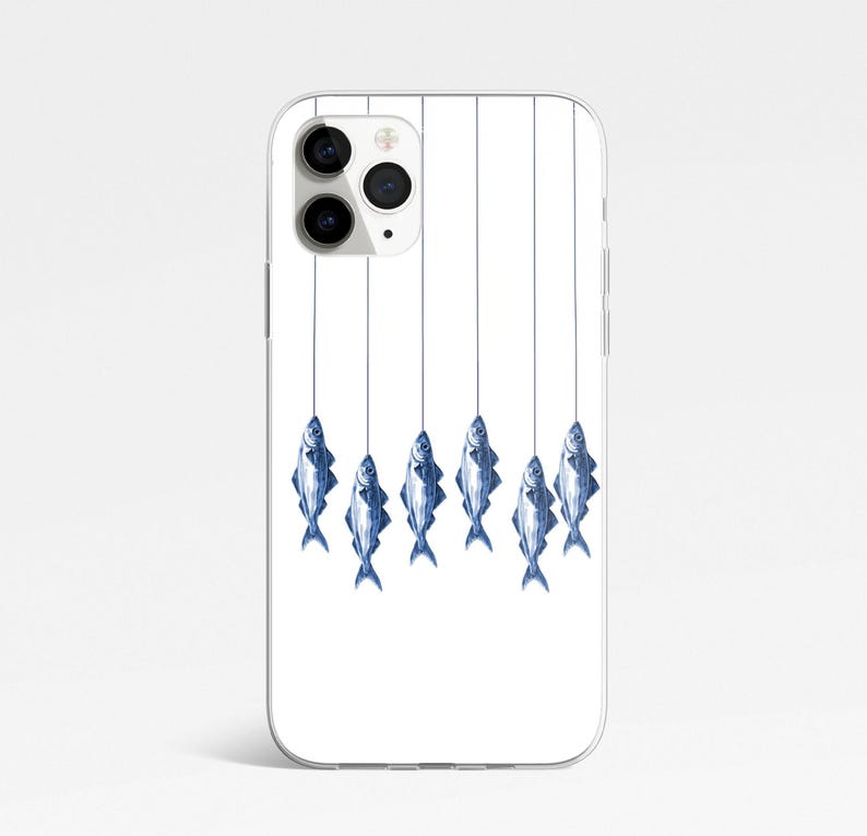 May include: A white iPhone case with a design of six blue fish hanging from strings. The fish are all facing the same direction and have a realistic design.