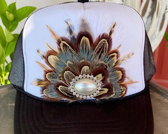 Feather Trucker Hat:  White with black mesh, pheasant feather embellishment