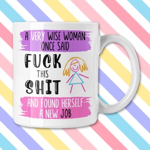 May include: White ceramic mug with a humorous message in black and purple text: "A VERY WISE WOMAN ONCE SAID FUCK THIS SHIT AND FOUND HERSELF A NEW JOB." A whimsical drawing of a person is also on the mug.