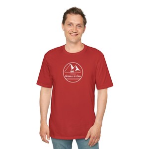 May include: A red t-shirt with a white graphic of mountains and trees in a circle with the text "Catskills & Chill".