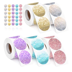 May include: Four rolls of round stickers with glitter designs. Each roll has three different colours of glitter stickers: gold, silver, purple, pink, blue, and turquoise.