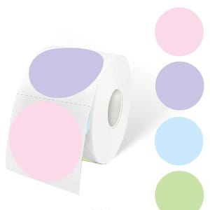May include: A roll of pastel coloured round stickers. The stickers are in shades of pink, lavender, light blue, and light green. The stickers are on a roll and are ready to be used.