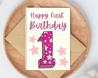 May include: A white card with pink and white stars and the text "Happy First Birthday" with a large pink number one with pink and white stars.