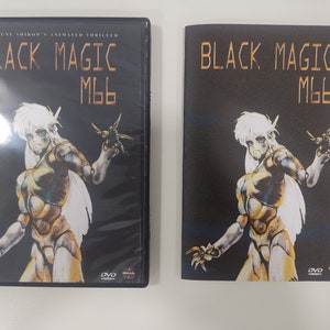 May include: A DVD case and booklet for the animated thriller "Black Magic M66". The cover art features a female character with white hair, wearing a metallic suit, and holding a small, flying object.