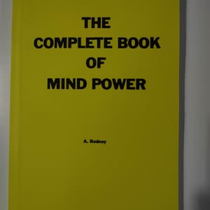 May include: A yellow book with the title "THE COMPLETE BOOK OF MIND POWER" and the author's name "A. Rodney" printed on the cover.