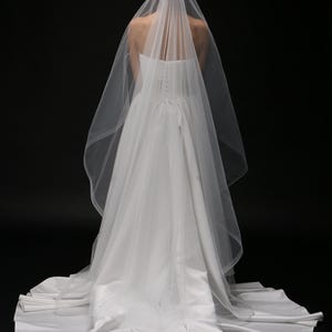 bride wearing chapel length veil back view